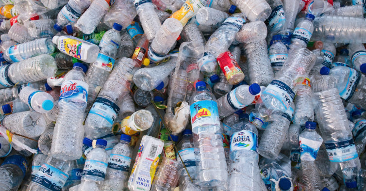 Full Frame Shot Of Plastic Bottles At Junkyard